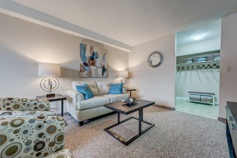 a living room with a couch and a table